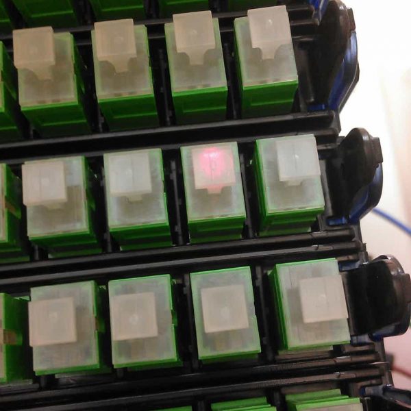 See the connector that's lit up with the red light? It means the first successful test of a fiber line to a customer. This connection is to the Carnegie Park.